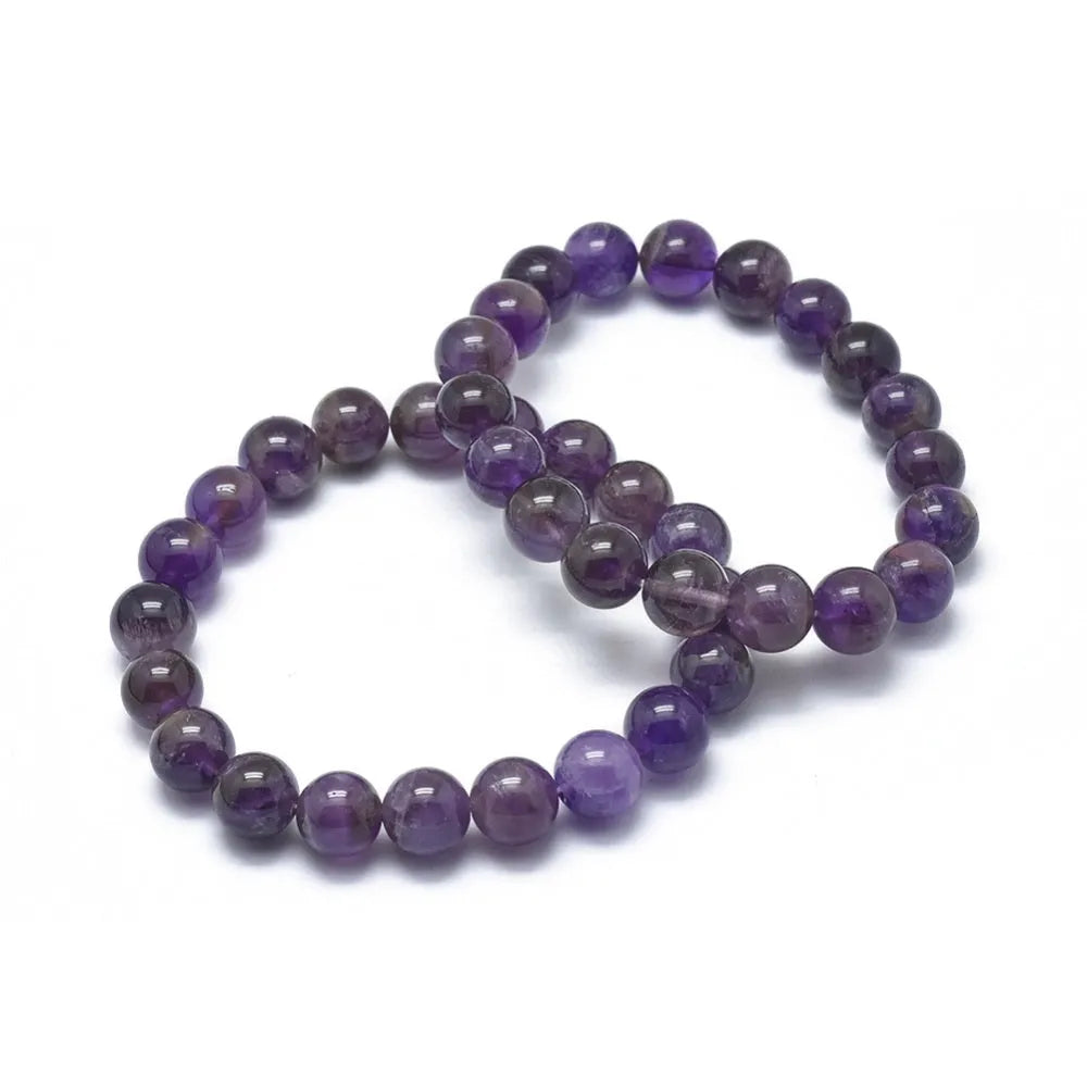Amethyst rounded crystal bracelet with purple stone beads for crown chakra healing and intuition from The Witches Hollow UK