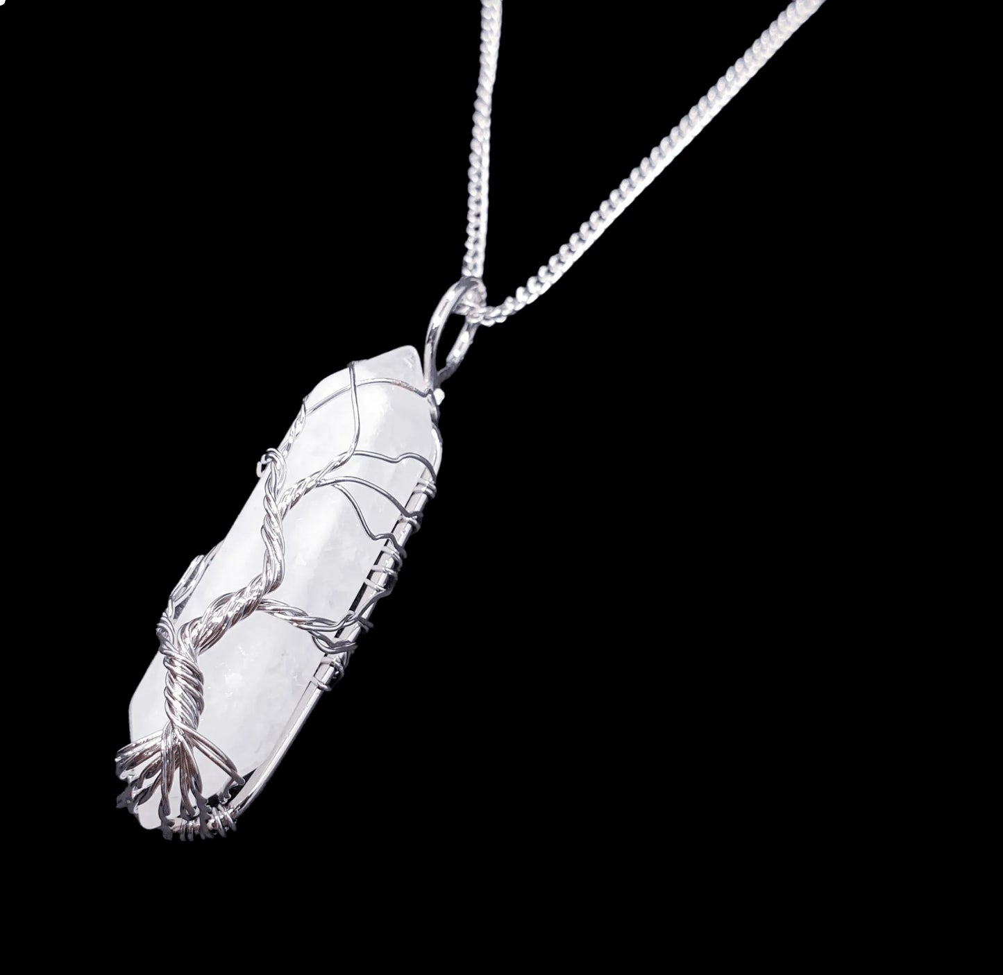 Clear quartz wire tree pendant detail showing master healer crystal tree of life design from The Witches Hollow UK