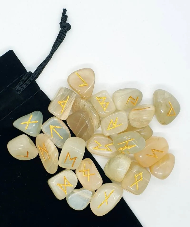Moonstone futhark rune set detail showing cream stones for ancient wisdom and goddess energy from The Witches Hollow UK