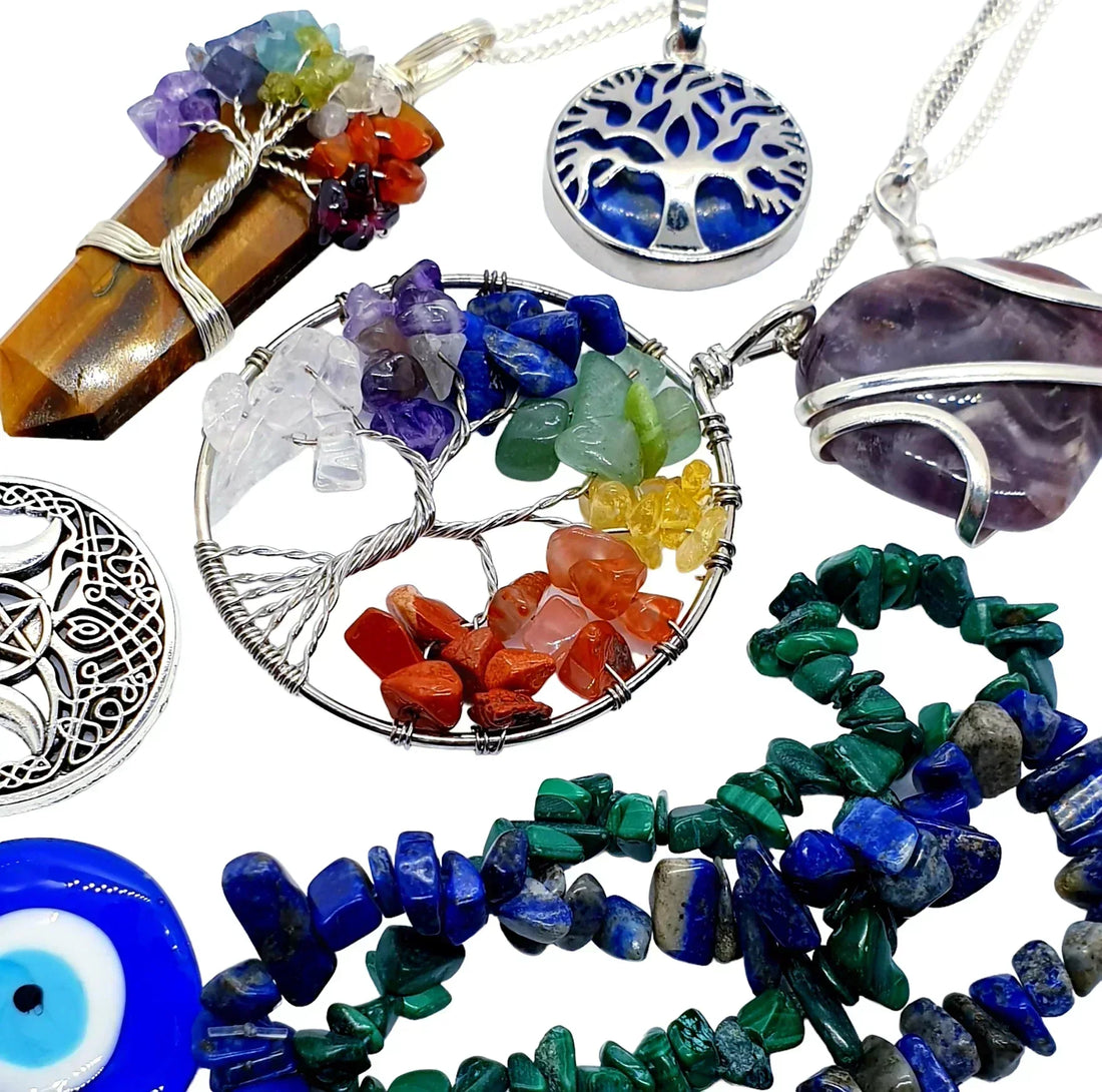 Crystal healing jewelry collection featuring chakra tree of life pendants, amethyst wire wrapped stones, malachite chip bracelets and protective amulets for metaphysical cleansing UK