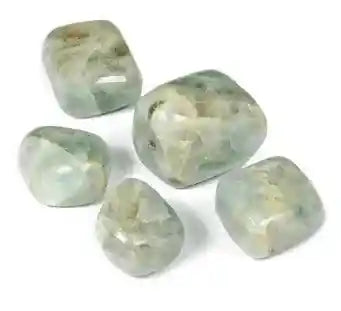 Aquamarine tumble stone with blue crystal for communication and throat chakra healing from The Witches Hollow UK