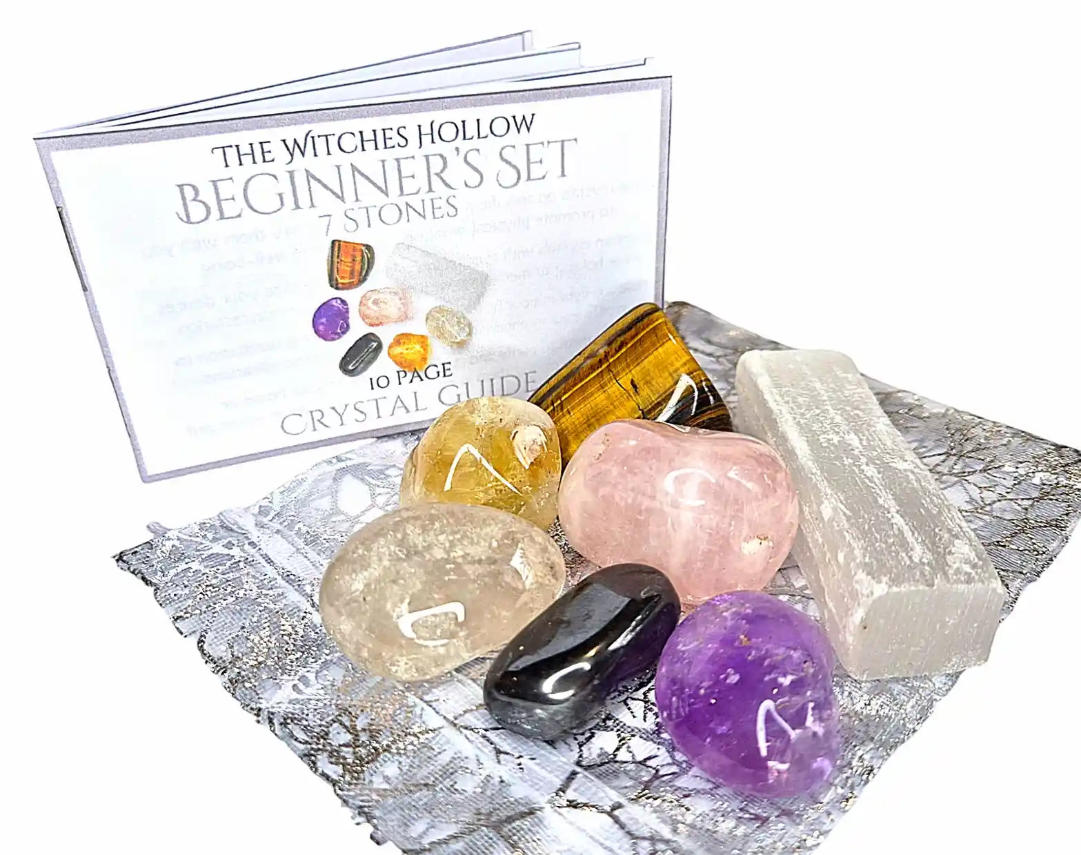 Beginner crystal healing set with 7 stones including tigers eye, amethyst, selenite, rose quartz, clear quartz and hematite with crystal guide from The Witches Hollow UK