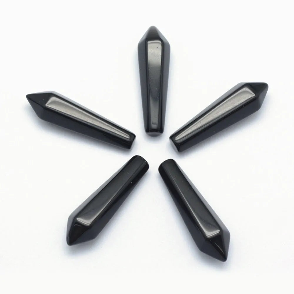 Black obsidian crystal point with volcanic glass for spiritual protection and energy clearing from The Witches Hollow UK