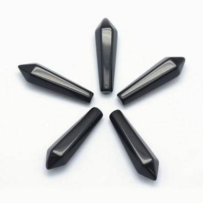 Black obsidian crystal point with volcanic glass for spiritual protection and energy clearing from The Witches Hollow UK