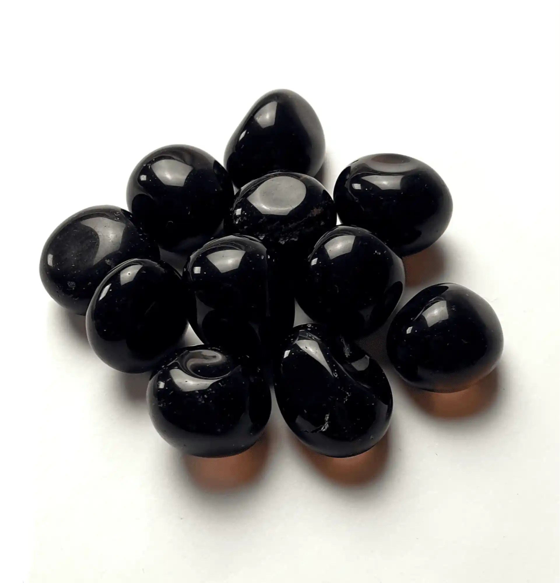 Black obsidian tumble stone with volcanic glass for protection and spiritual grounding from The Witches Hollow UK