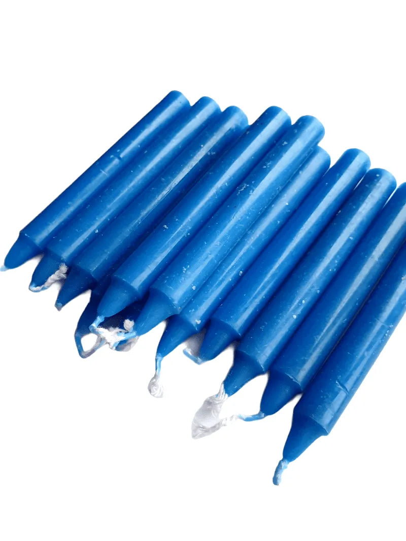 Blue spell candle with blue wax for tranquility and throat chakra magic from The Witches Hollow UK