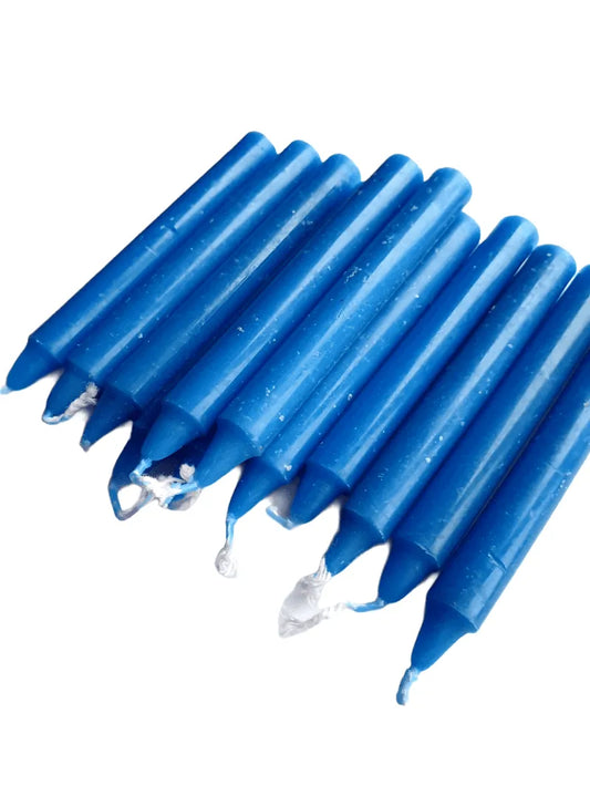 Blue spell candle with blue wax for tranquility and throat chakra magic from The Witches Hollow UK