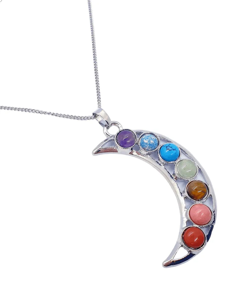 Chakra crescent moon pendant with seven colored stones for lunar energy and chakra alignment from The Witches Hollow UK