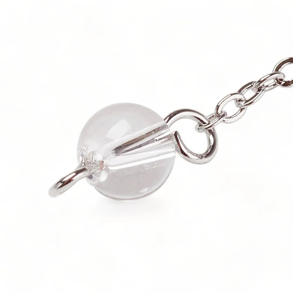 Clear quartz merkaba dowsing pendulum detail with star crystal for spiritual clarity and guidance from The Witches Hollow UK