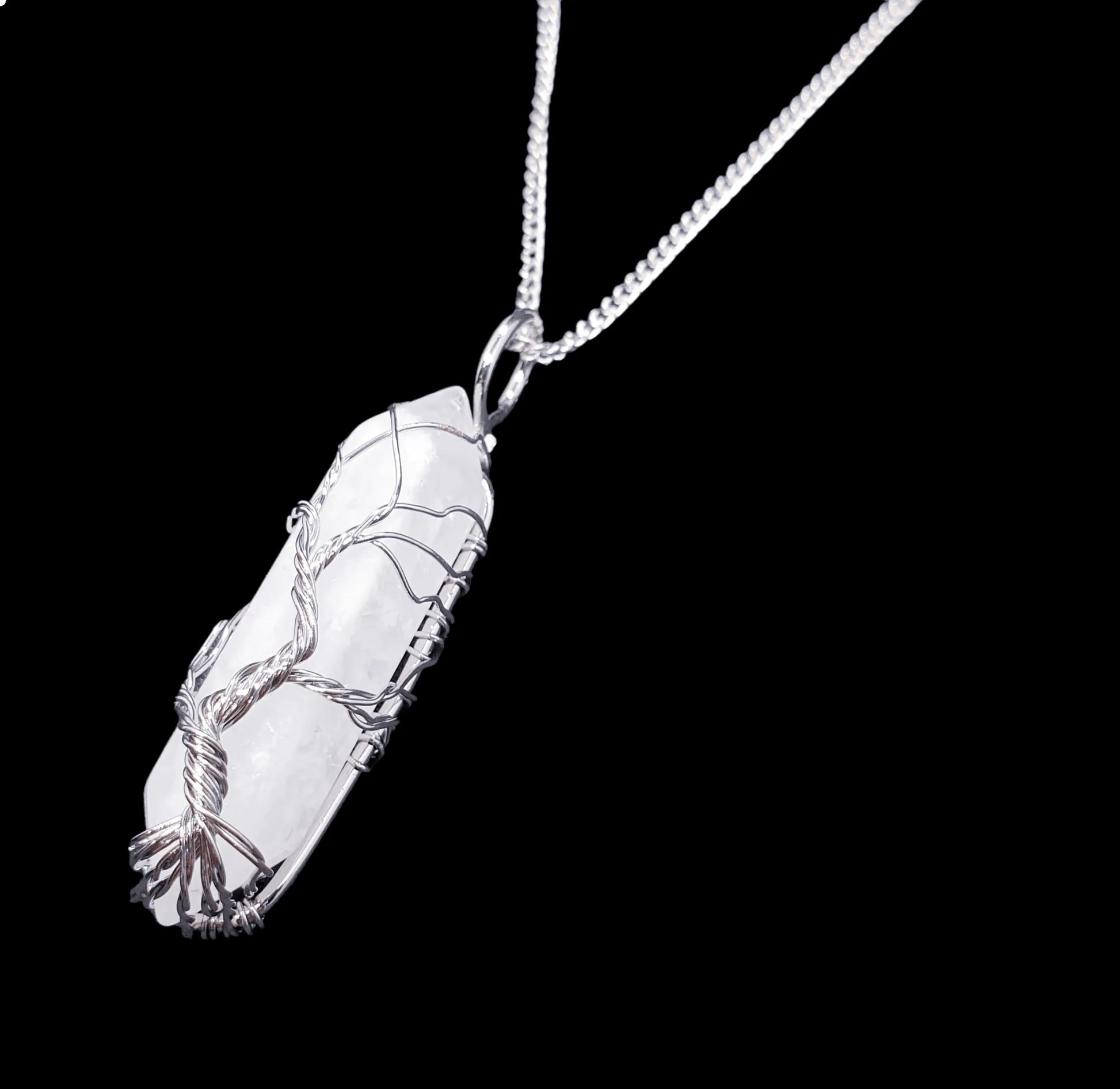 Clear quartz wire tree pendant detail showing master healer crystal tree of life design from The Witches Hollow UK