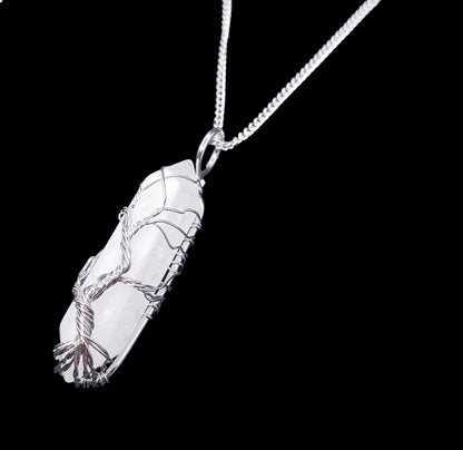 Clear quartz wire tree pendant detail showing master healer crystal tree of life design from The Witches Hollow UK