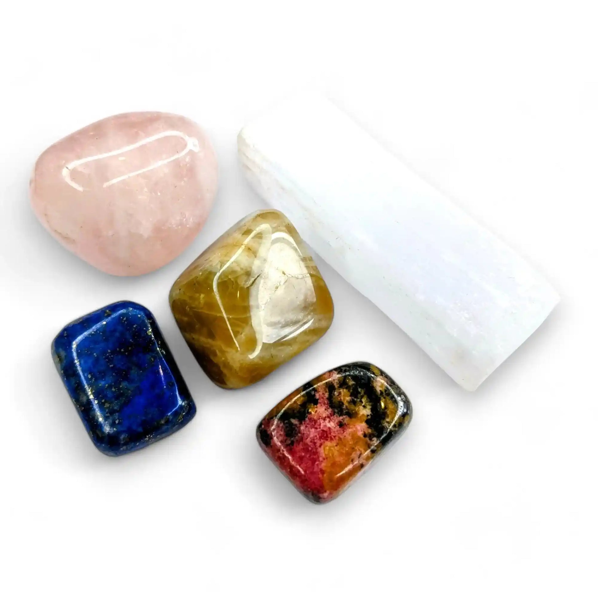 Feminine energy healing crystals set featuring rose quartz, selenite, moonstone, lapis lazuli and rhodonite for goddess power and divine feminine energy