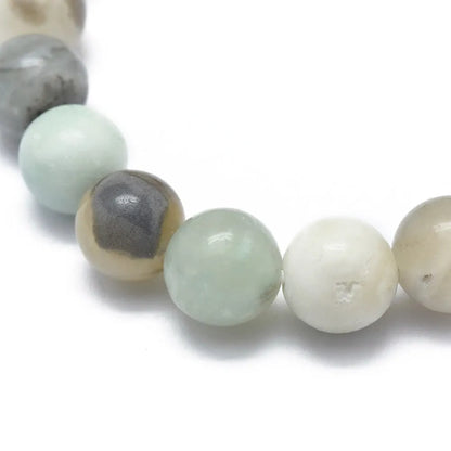Flower amazonite crystal bracelet detail with blue-green stones for throat chakra healing from The Witches Hollow UK