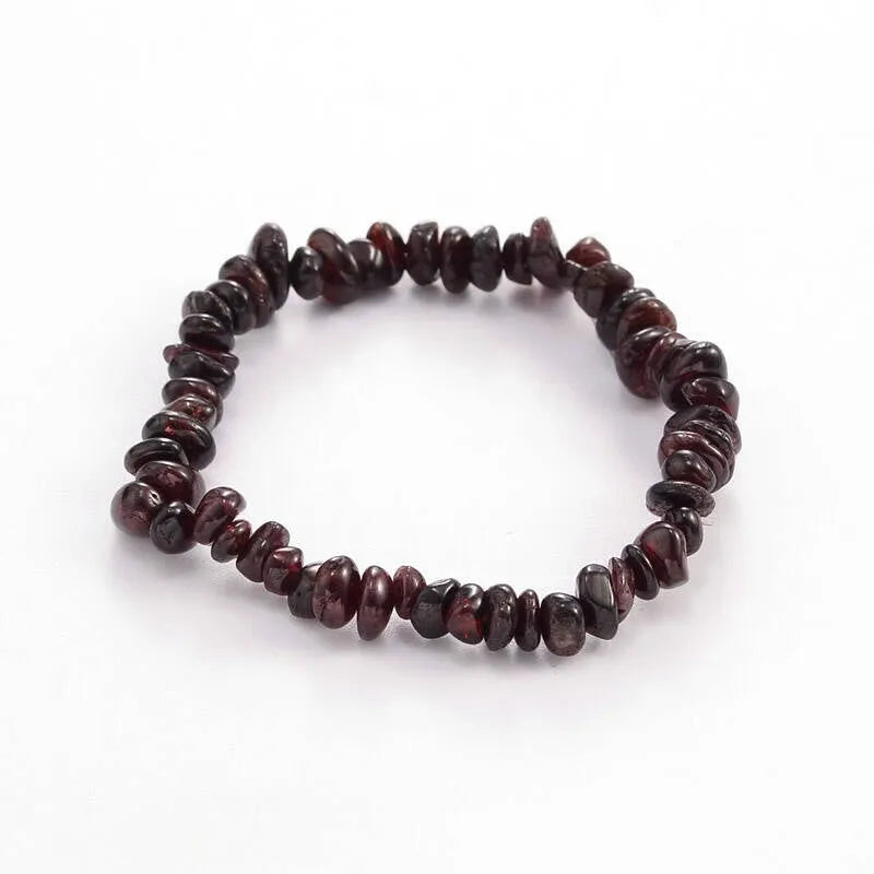 Garnet crystal bracelet detail with deep red stones for passion and root chakra grounding from The Witches Hollow UK