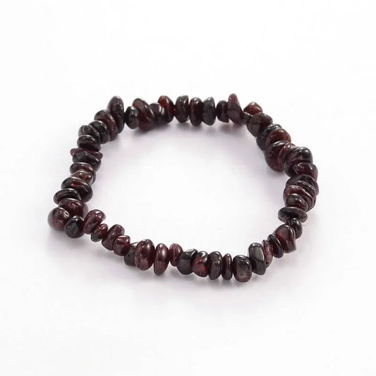 Garnet crystal bracelet detail with deep red stones for passion and root chakra grounding from The Witches Hollow UK