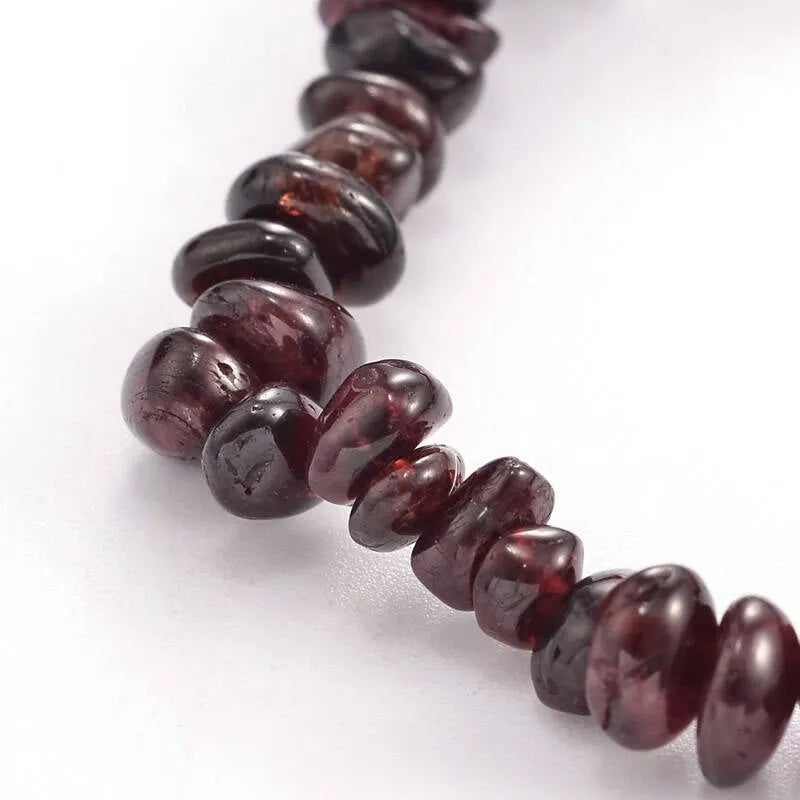 Garnet crystal bracelet featuring red healing stones for vitality and life force energy from The Witches Hollow UK
