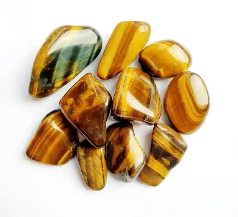 Golden tigers eye tumble stone with golden brown crystal for courage and personal power from The Witches Hollow UK