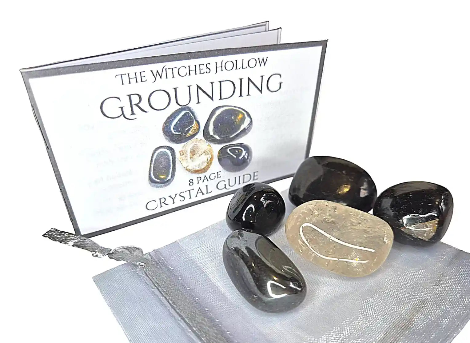 Grounding crystal healing pack with hematite, black tourmaline, smoky quartz stones in silver organza bag with crystal guide from The Witches Hollow UK