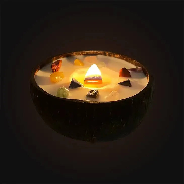 Handmade chakra coconut candle with rainbow crystals for chakra healing and natural lighting from The Witches Hollow UK