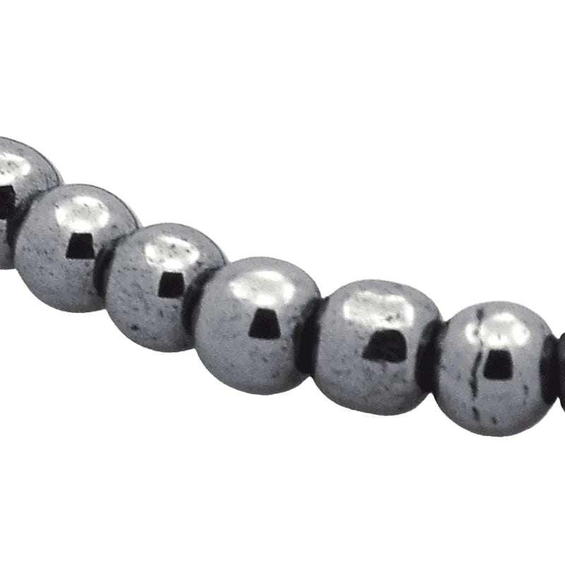 Hematite crystal bracelet featuring black metallic stones for root chakra grounding and strength from The Witches Hollow UK