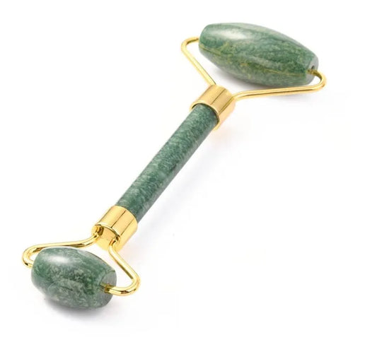 Jade facial roller detail showing green crystal tool for traditional skincare and healing from The Witches Hollow UK