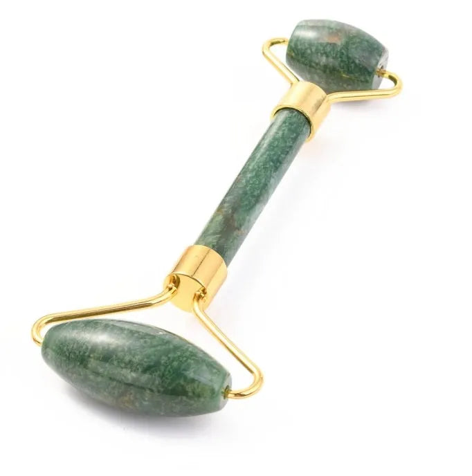 Jade facial roller with green healing crystal for skincare routine and prosperity energy from The Witches Hollow UK