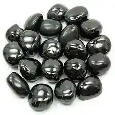 Jet tumble stone with black fossil crystal for protection and grounding energy from The Witches Hollow UK