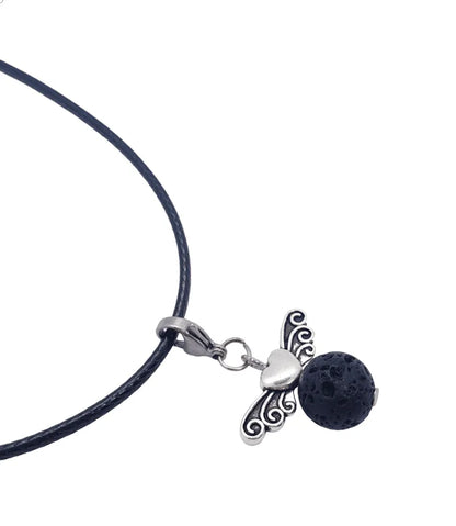 Lava stone angel charm detail showing volcanic stone angel for spiritual protection and aromatherapy from The Witches Hollow UK