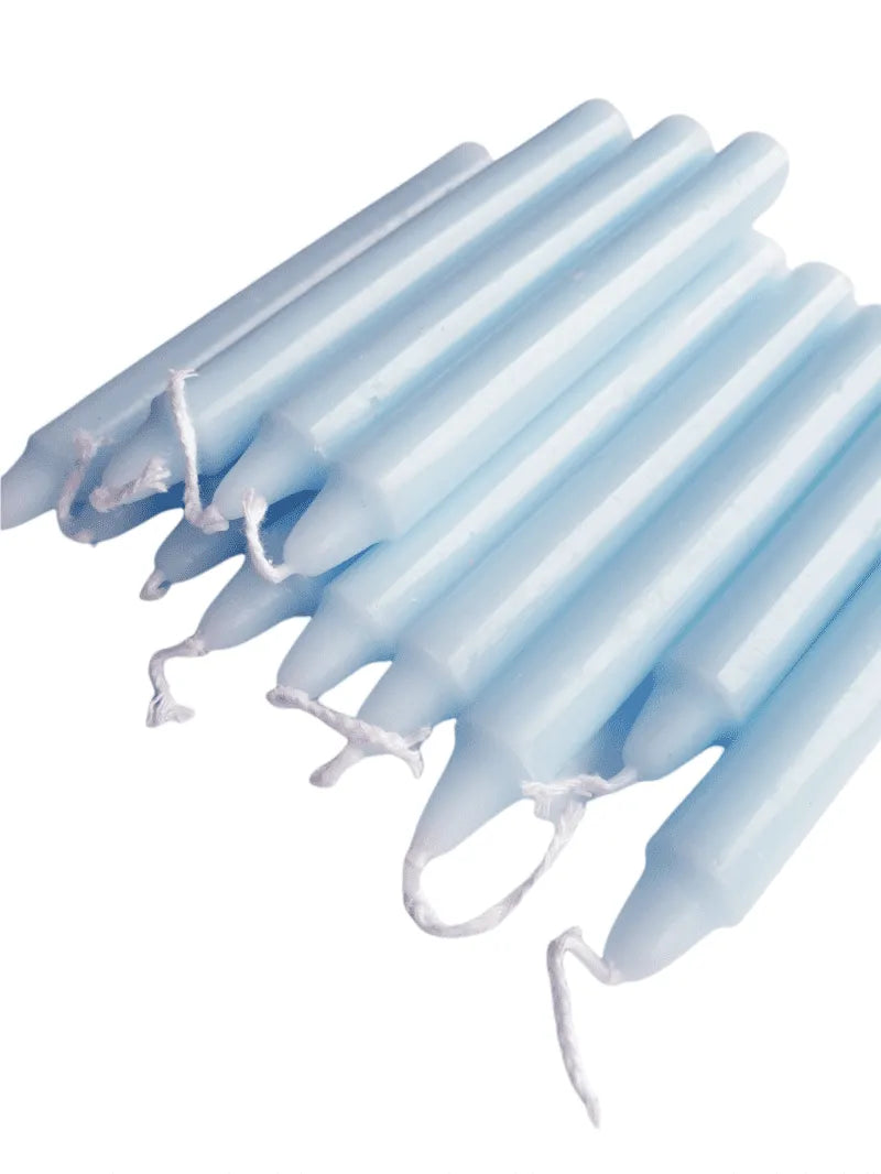 Light blue spell candle with blue wax for communication and throat chakra magic from The Witches Hollow UK