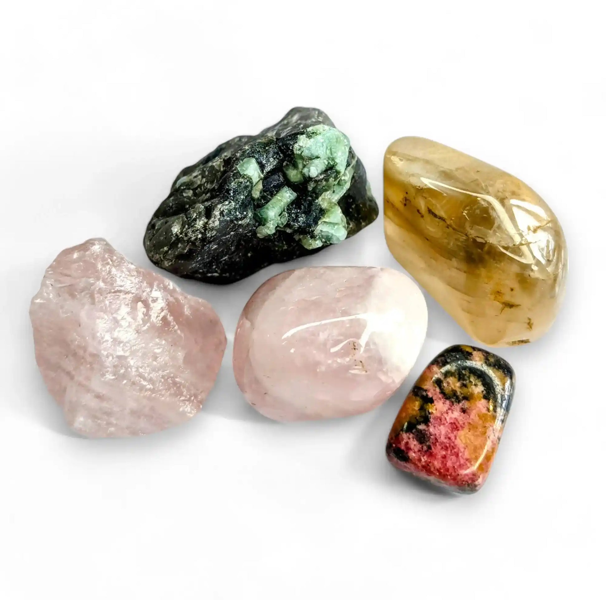 Love attraction healing crystals set featuring rose quartz, emerald, rhodonite, citrine and moonstone for heart chakra and romance