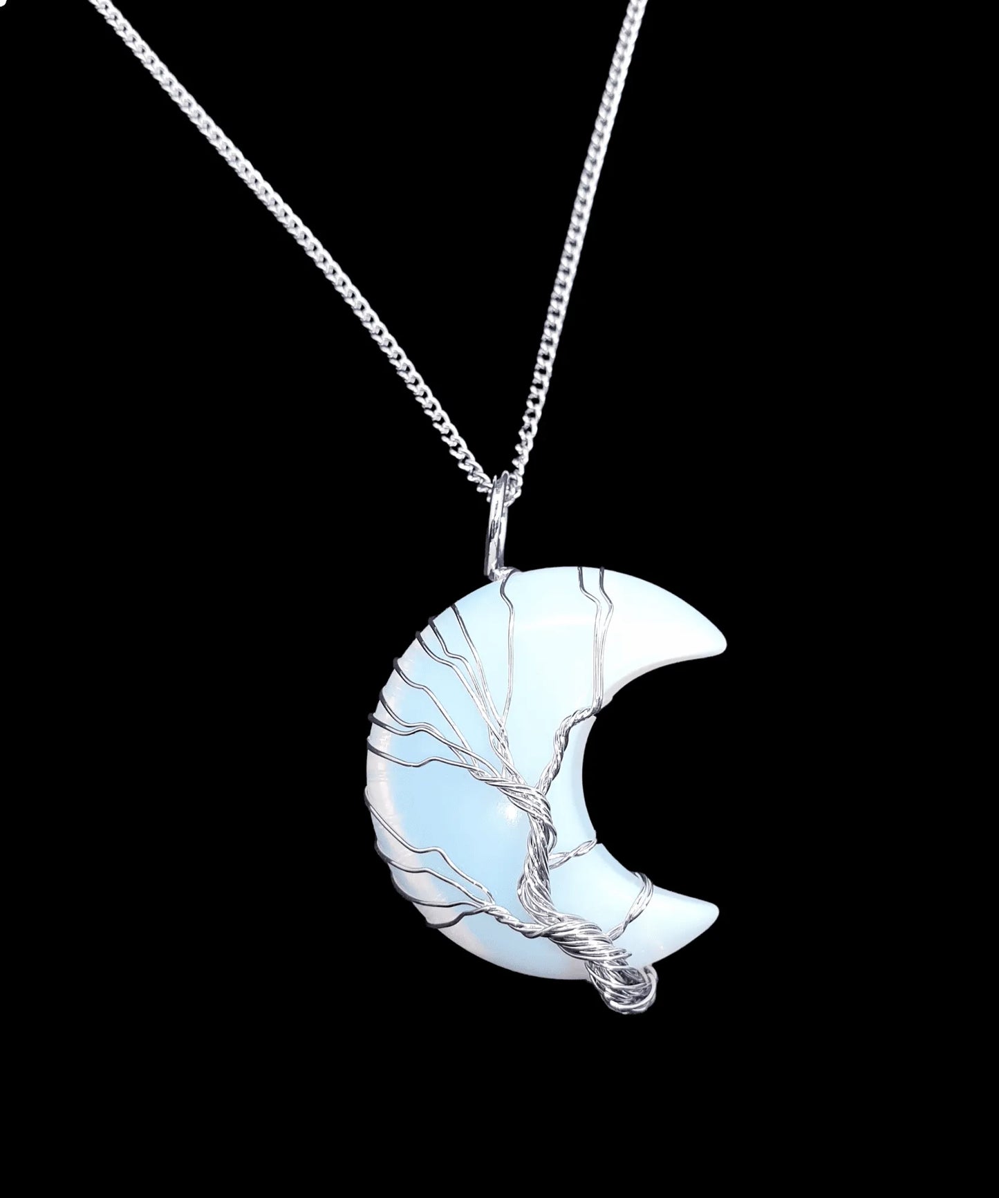 Opalite moon wire wrapped pendant detail showing opalescent crystal moon for lunar connection from The Witches Hollow UK
