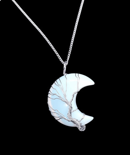Opalite moon wire wrapped pendant detail showing opalescent crystal moon for lunar connection from The Witches Hollow UK