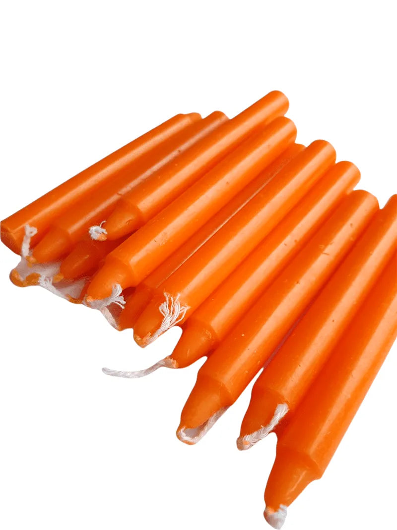 Orange spell candle with orange wax for success and sacral chakra magic from The Witches Hollow UK