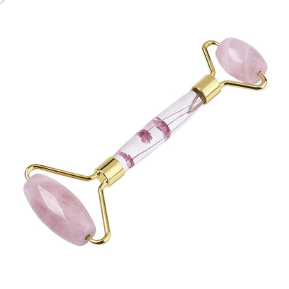 Rose quartz facial roller featuring pink healing crystal for beauty routine and self-care from The Witches Hollow UK