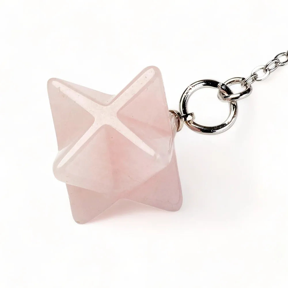 Rose quartz merkaba dowsing pendulum alternative view with pink star crystal for emotional healing from The Witches Hollow UK