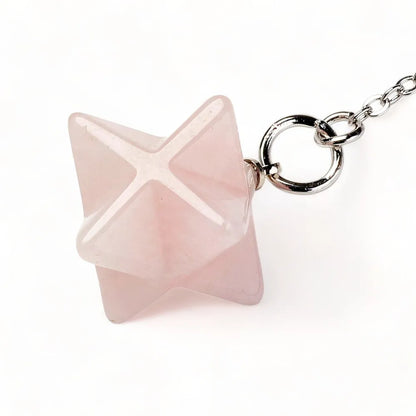 Rose quartz merkaba dowsing pendulum alternative view with pink star crystal for emotional healing from The Witches Hollow UK