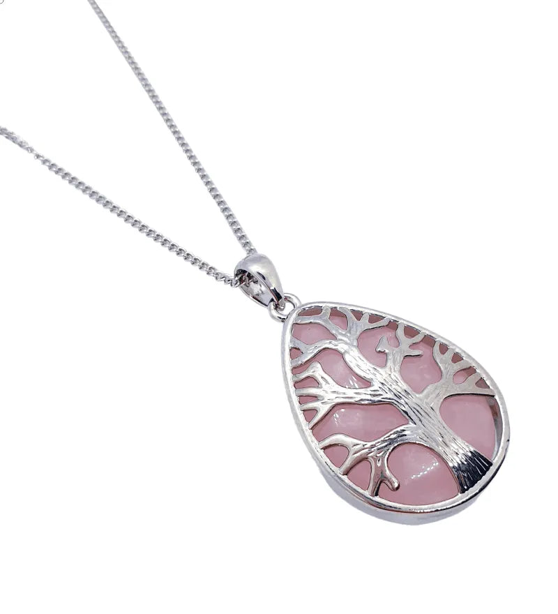 Rose quartz pendant detail with pink crystal for unconditional love and heart chakra healing from The Witches Hollow UK