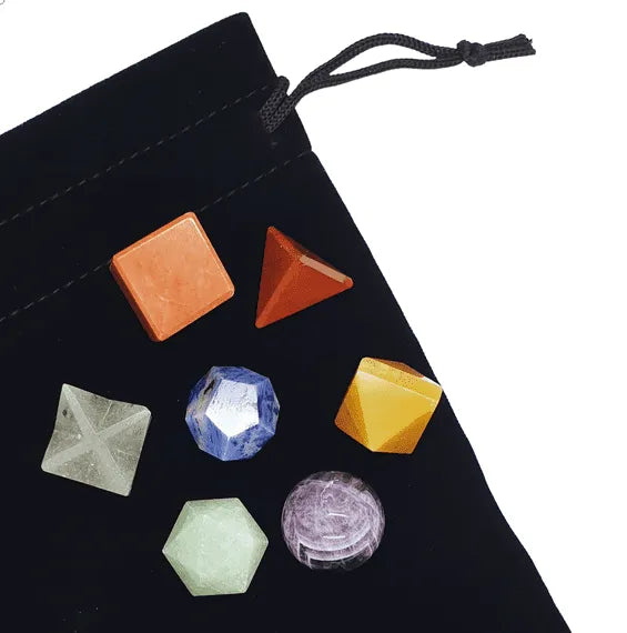 Seven chakra crystal geometry set with colored stones for sacred geometry healing and energy work from The Witches Hollow UK