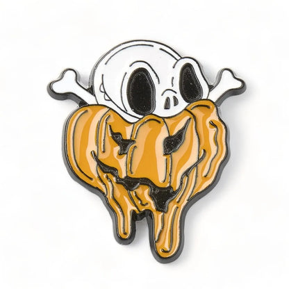 Skull melting pumpkin enamel pin with gothic Halloween design for spooky style from The Witches Hollow UK