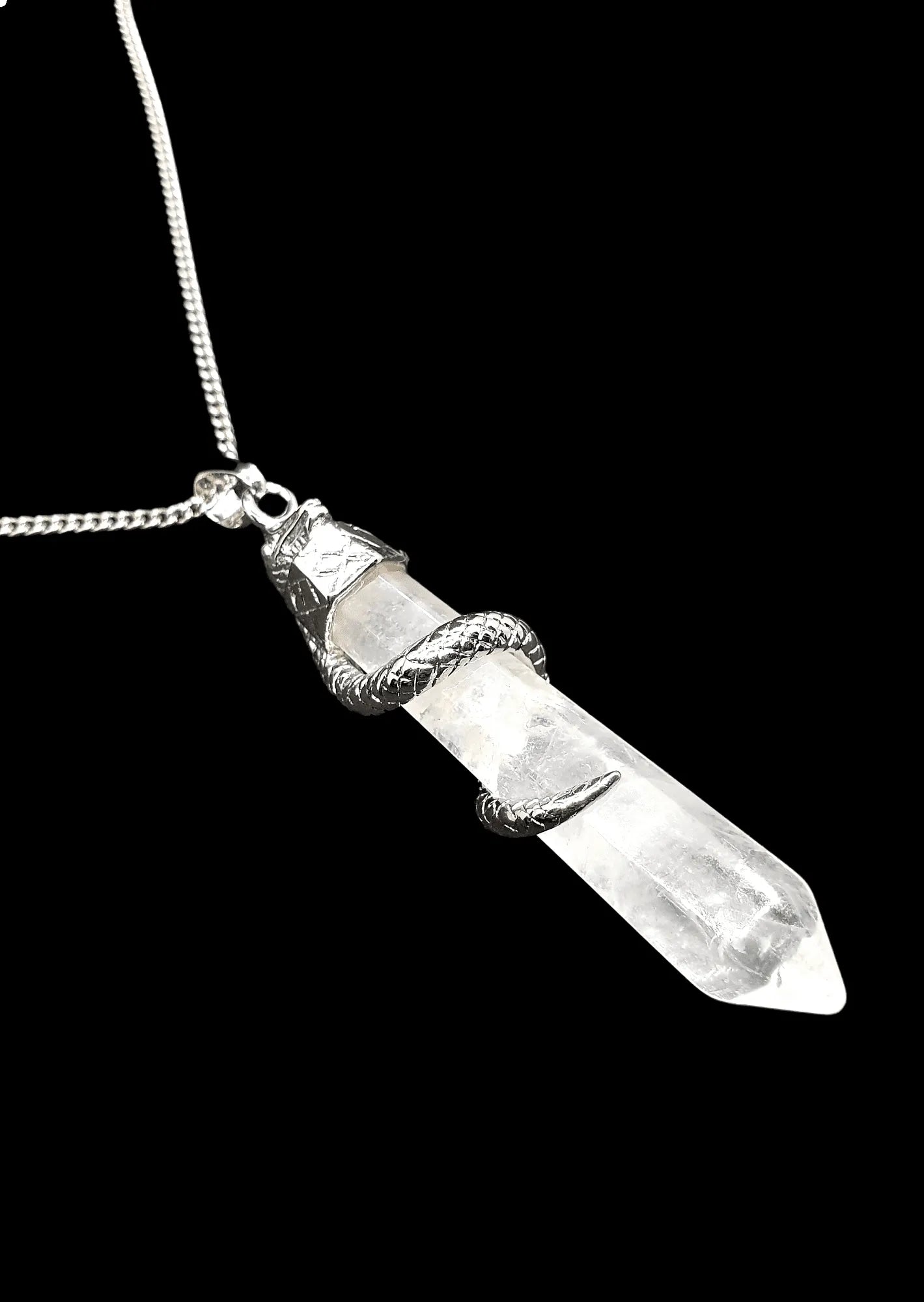 Snake quartz point pendant detail showing clear crystal with serpent energy for transformation from The Witches Hollow UK