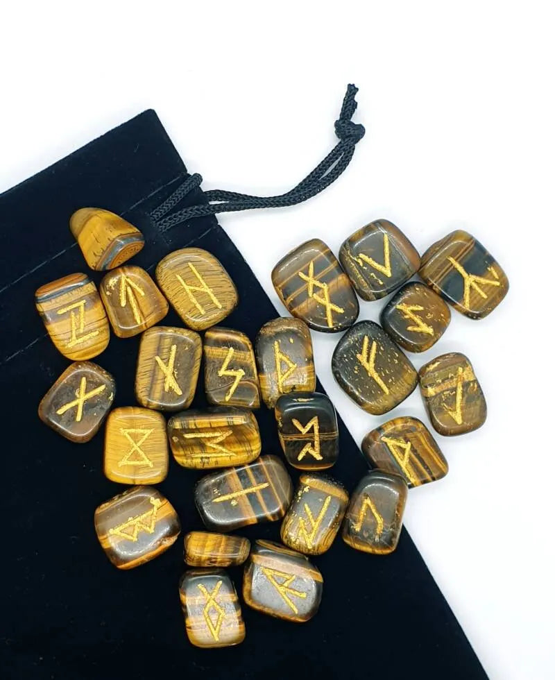 Tigers eye futhark rune set detail showing golden rune stones for Viking divination and guidance from The Witches Hollow UK