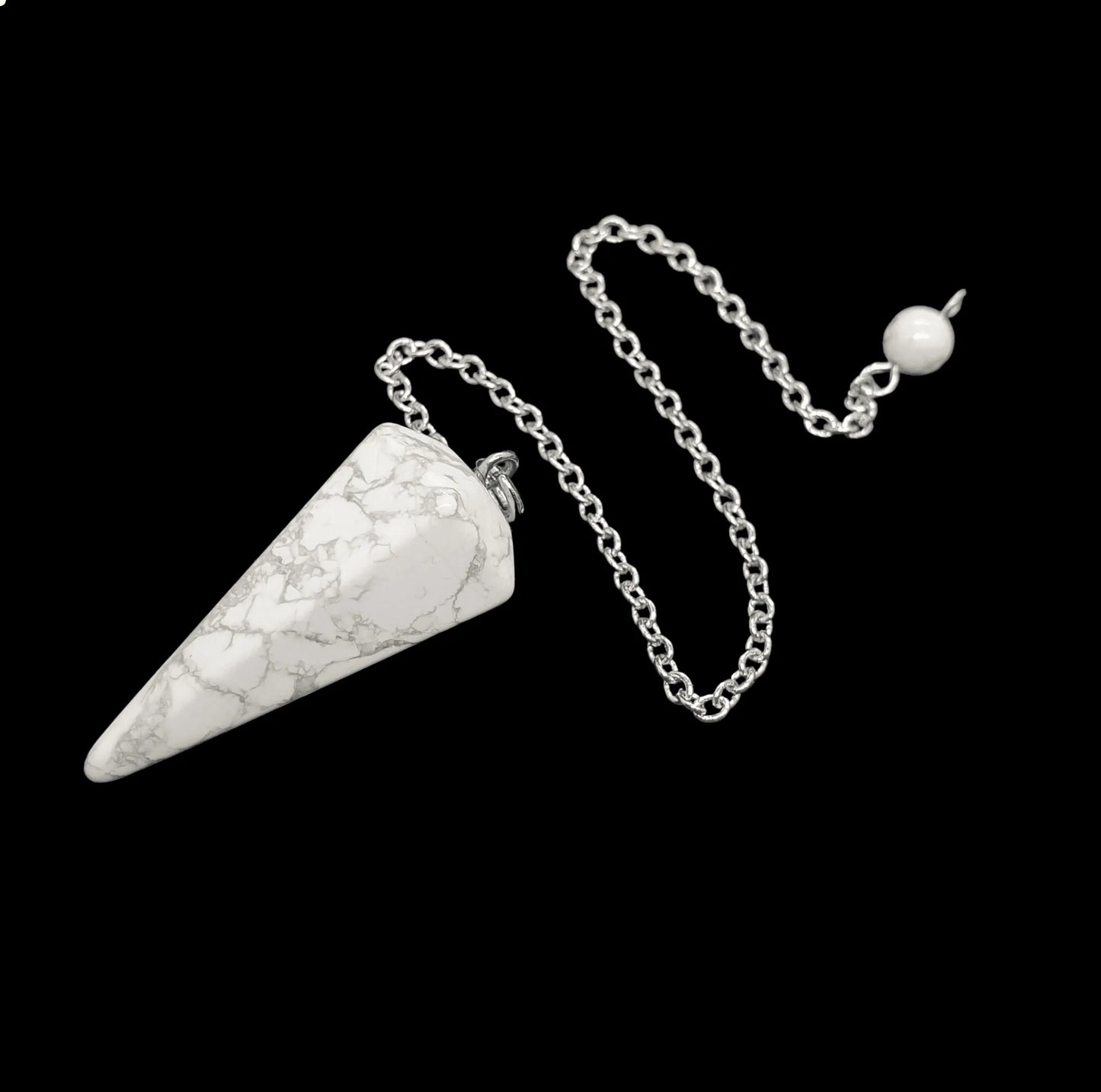 White howlite faceted cone pendulum alternative view showing white crystal for anxiety relief divination from The Witches Hollow UK